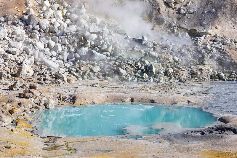 Aquamarine water pool with stone surround